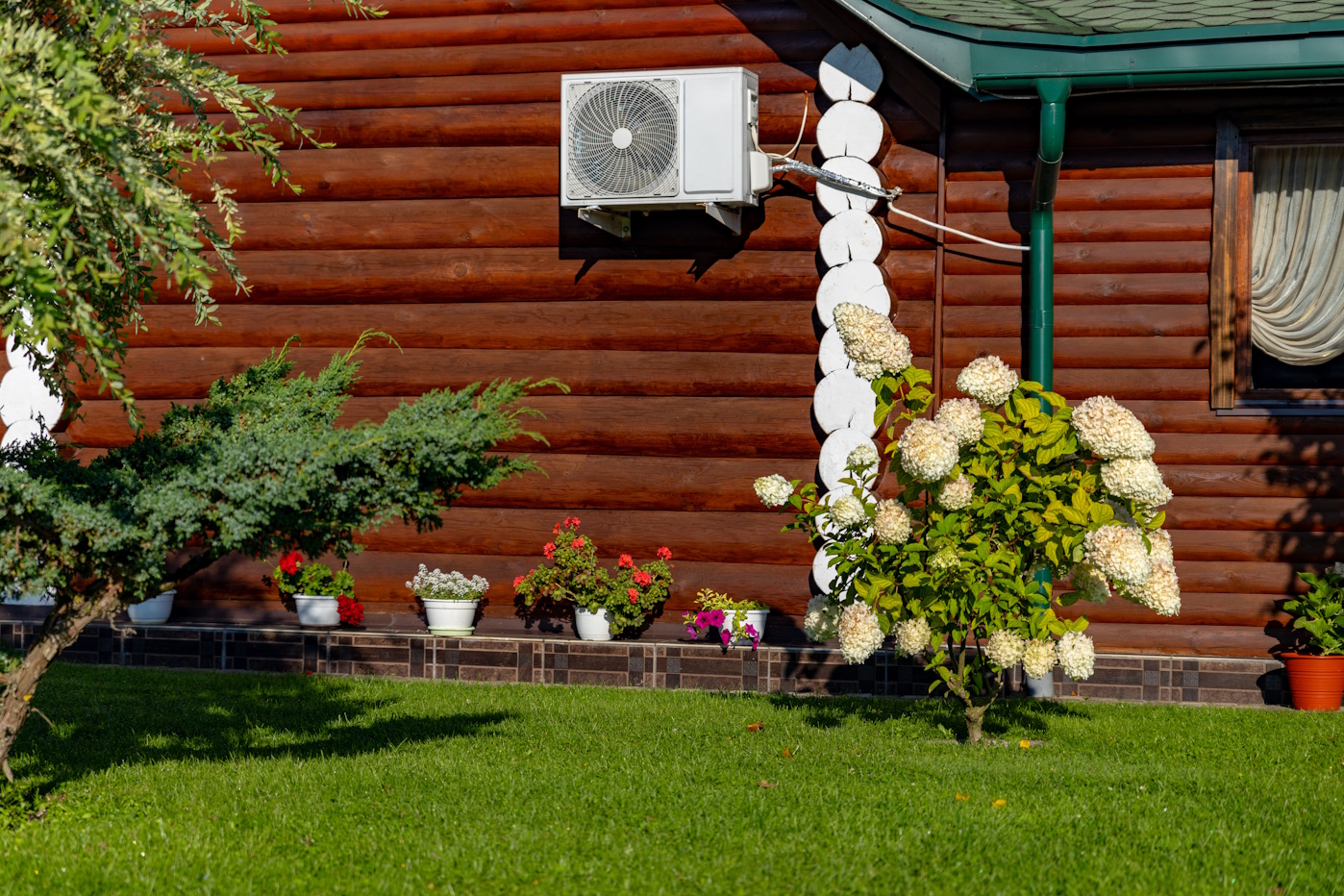 air conditioning unit installed in a log cabin