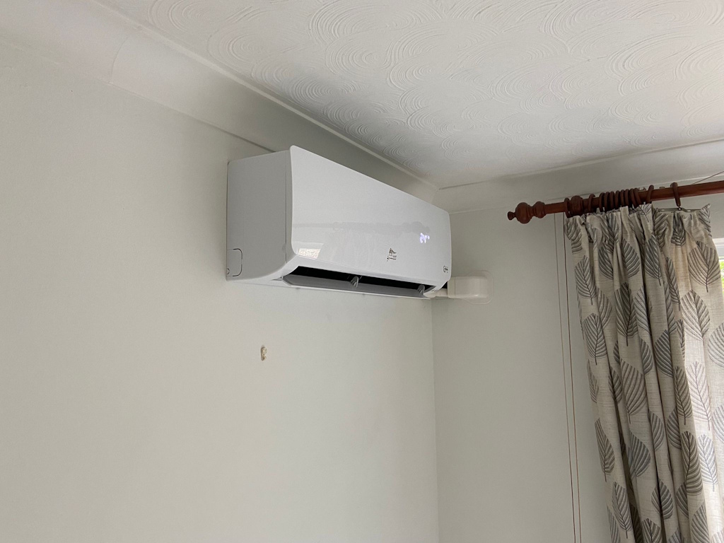 12000 BTU wall mounted air conditioning indoor unit installed in a residential property lounge