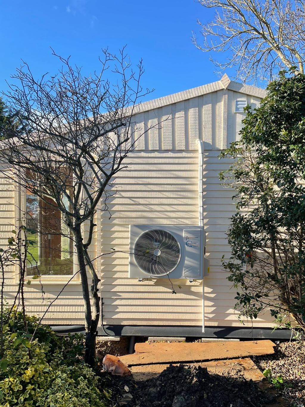 12000 BTU wall mounted air conditioning unit installed in a home garden office